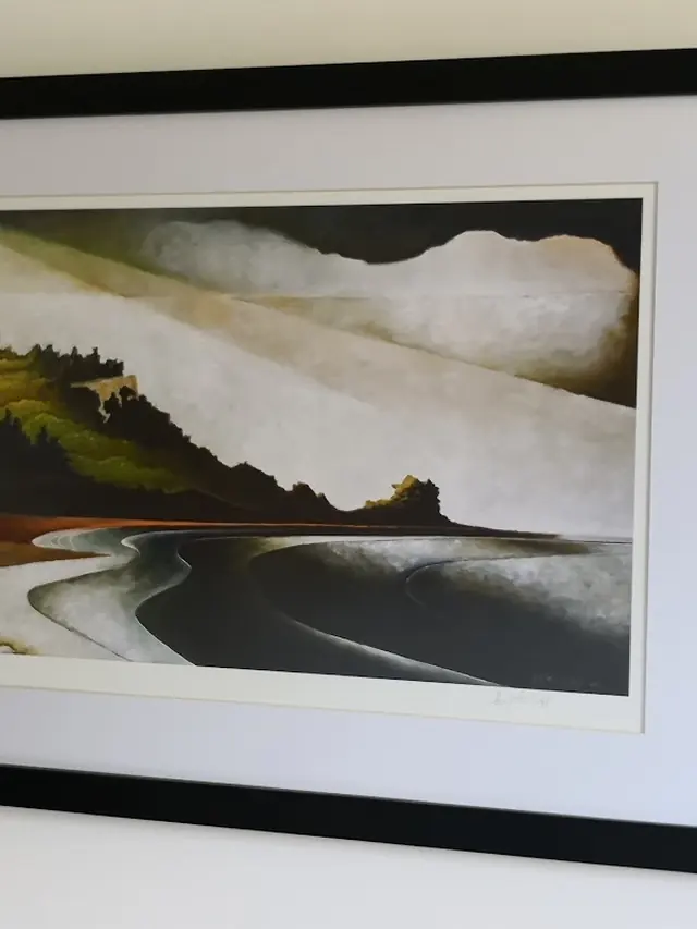 Landscape print in a wide black box frame